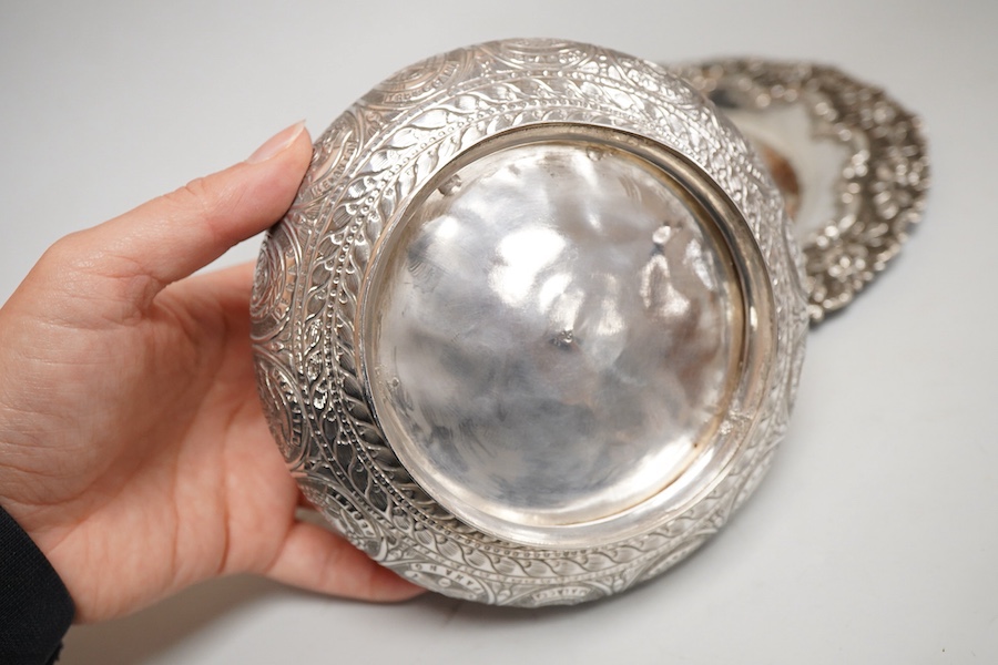 Two Indian white metal rose bowls, one octagonal with stand, diameter 12.5cm, together with a small white metal stand, with foliate border.